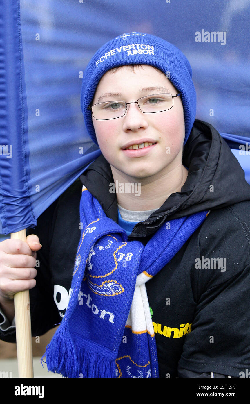 A flag bearer poses for a photograph on the pitch hires stock