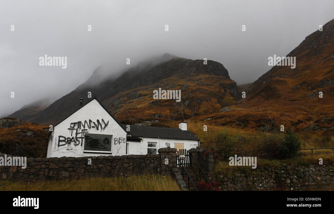 Slogans painted on the cottage owned by Jimmy Savile in Glencoe, Scotland Stock Photo Alamy