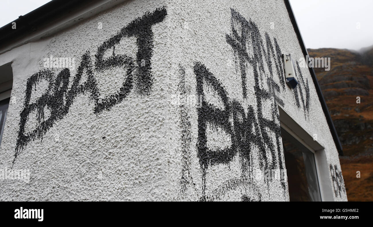 Slogans painted on the cottage owned by Jimmy Savile in Glencoe, Scotland. Stock Photo
