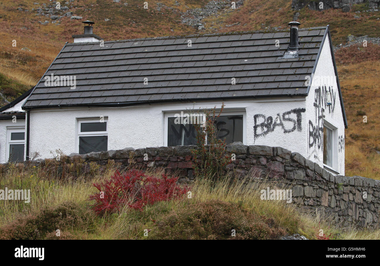 Slogans painted on the cottage owned by Jimmy Savile in Glencoe, Scotland Stock Photo Alamy