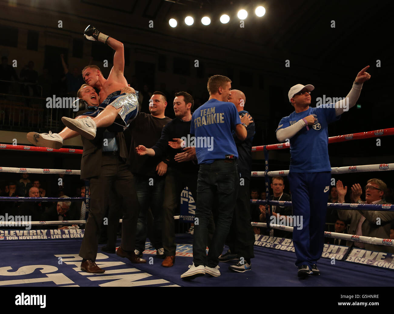 Frankie Gavin (left) in action agains raised aloft in celebration after beating Junior Witter during there British Welterweight Title fight at York Hall, London. Stock Photo