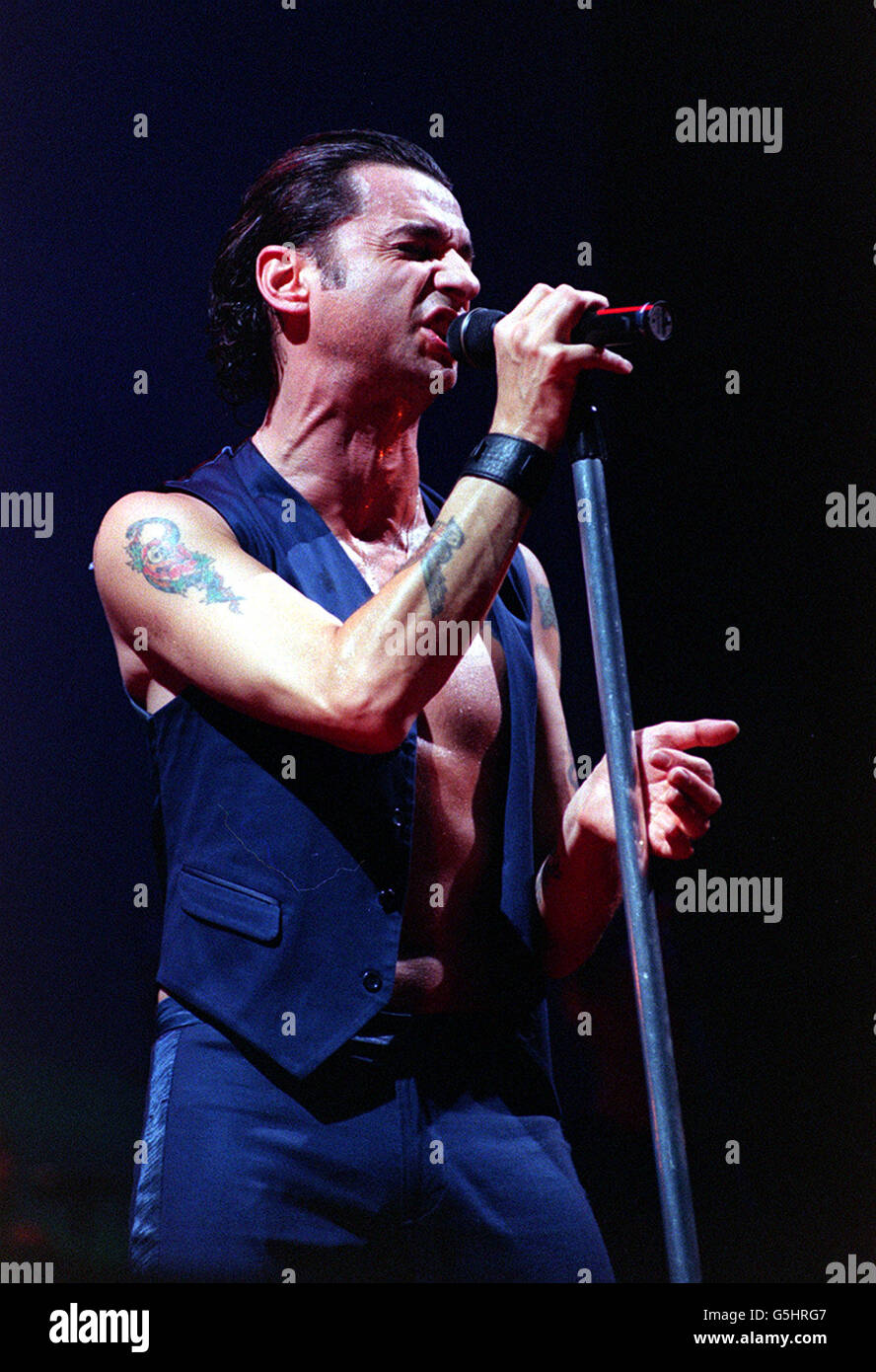 Lead singer Dave Gahan performs at Wembley Arena in London during Depeche  Mode's tour Stock Photo - Alamy