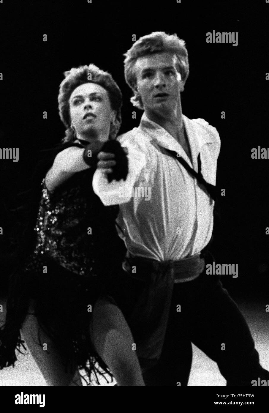 World and Olympic Ice Dance champions Jayne Torvill and Christopher Dean performing a move from one of their skating routines at Wembley arena. Stock Photo