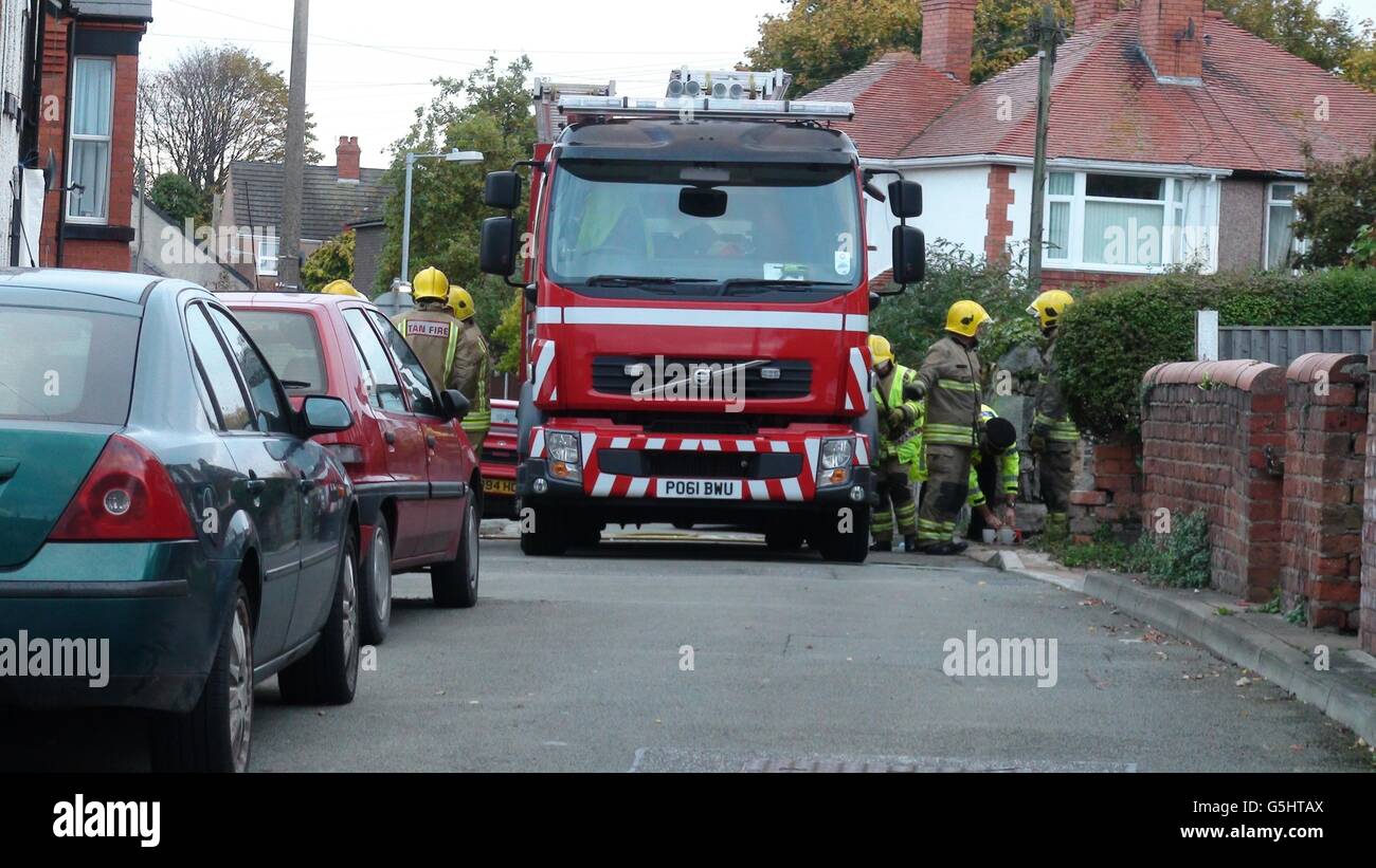Firefighters in attendance fire damage at a house in Maes Y Groes