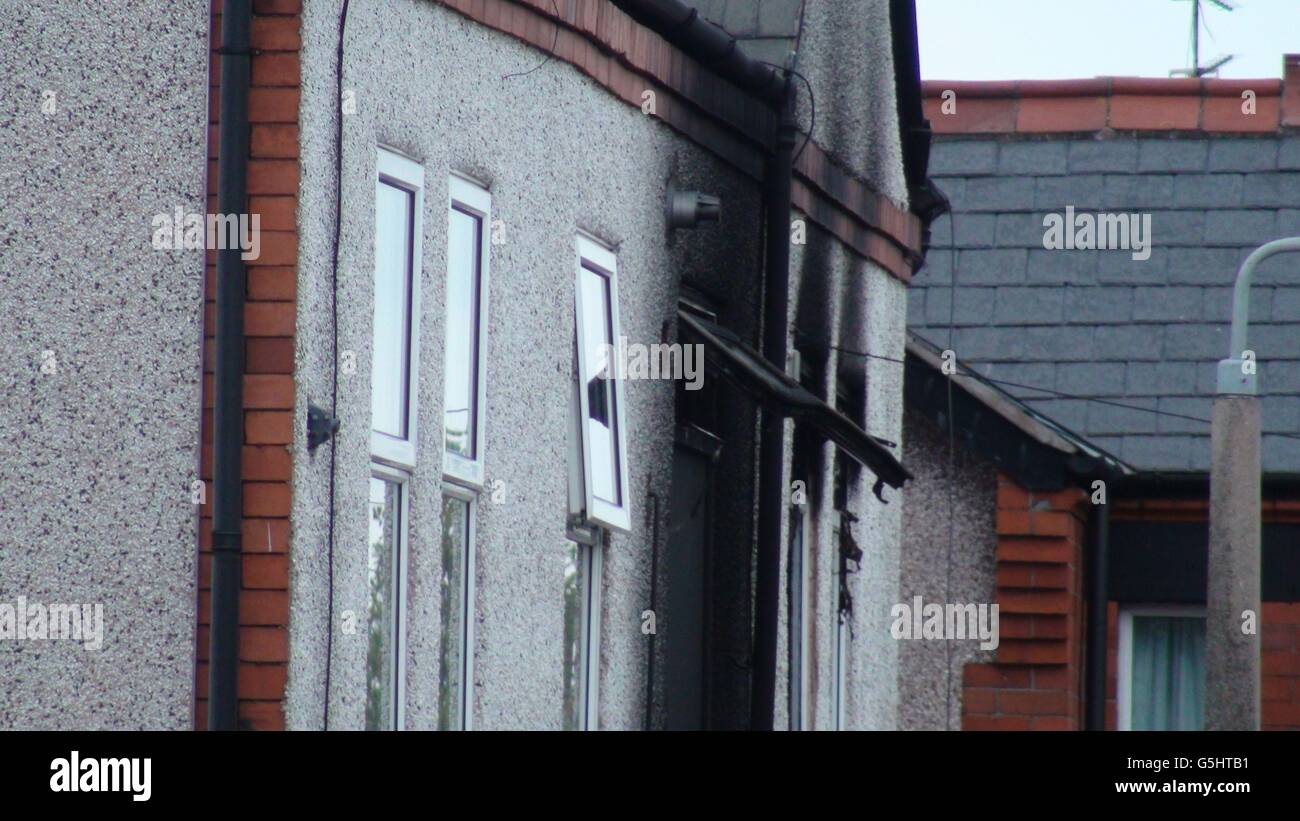 A general view of fire damage at a house in Maes Y Groes, Prestatyn, where a 20-year-old woman, a boy aged four and a two-year-old girl were pronounced dead by firefighters after the blaze broke out. Stock Photo