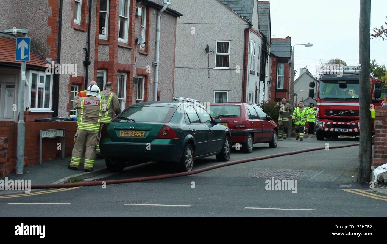Firefighters in attendance fire damage at a house in Maes Y Groes