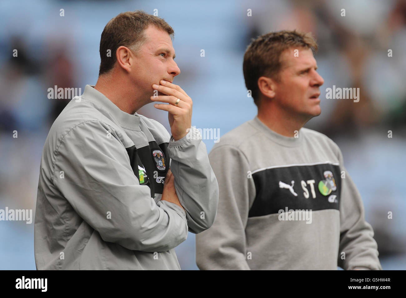 Coventry City manager Mark Robins and his assistant Steve Taylor (right) during the npower Football League One match at the Ricoh Arena, Coventry. Stock Photo