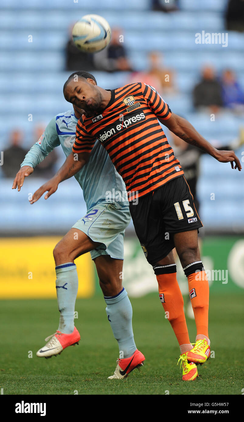 Coventry City's Jordan Clarke and Notts County's Yoann Arquin battle for the ball during the npower Football League One match at the Ricoh Arena, Coventry. Stock Photo