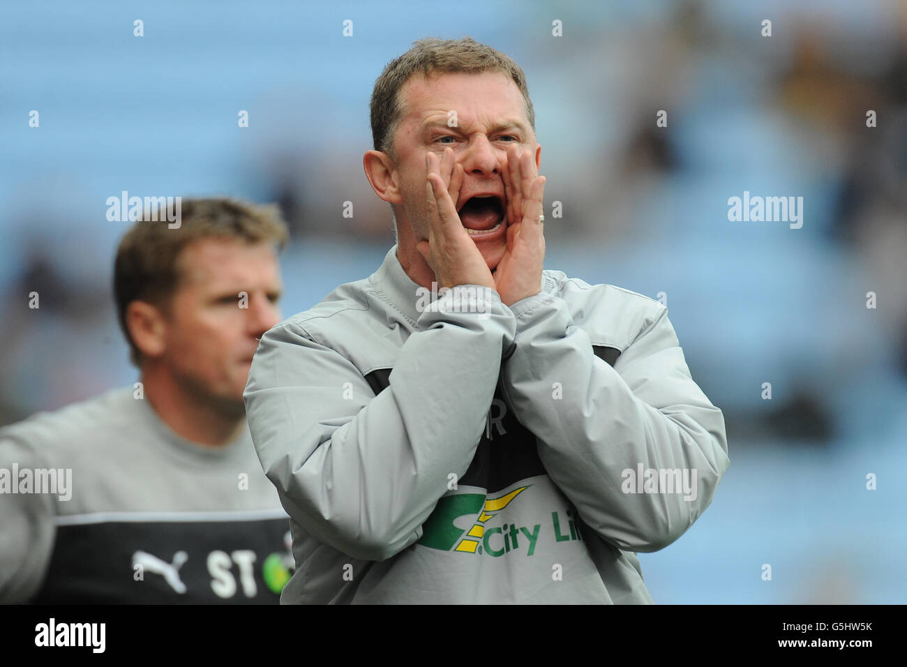 Coventry City manager Mark Robins and his assistant Steve Taylor (left) during the npower Football League One match at the Ricoh Arena, Coventry. Stock Photo