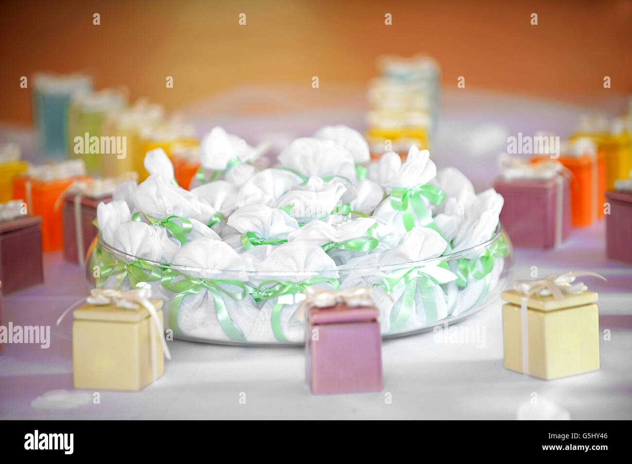 Assorted party favors displayed on a table with colorful gift boxes