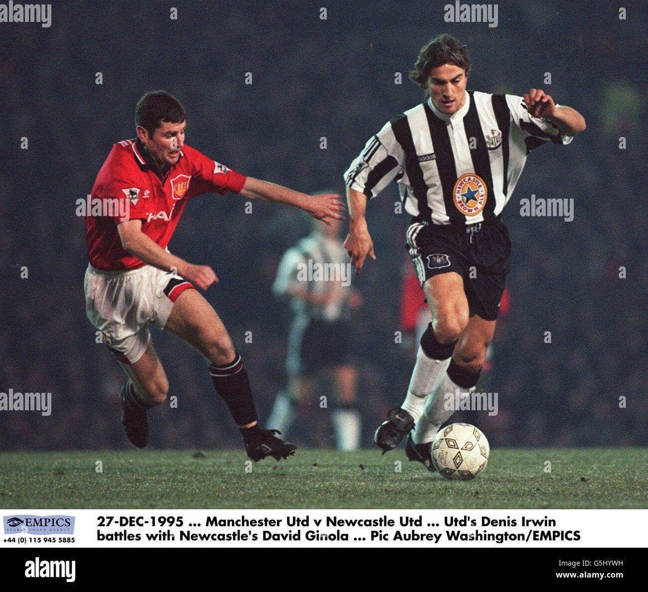 27-DEC-1995, Manchester United v Newcastle United, United's Denis Irwin  battles with Newcastle's David Ginola Stock Photo - Alamy
