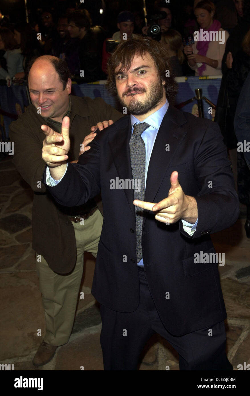 Jack Black (right) arrives at the premiere of his new film Shallow Hal being given a gentle push by former Seinfeld actor Jason Alexander at the Manns Village Theatre in Los Angeles. Stock Photo