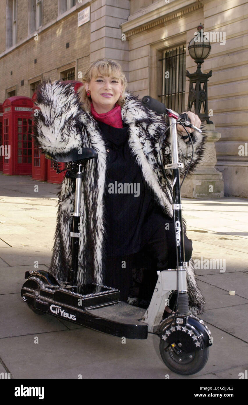 Magician Faye Presto (real name Letitia Winter) arrives at Bow Street Magistrates Court, London, on her electric scooter accused of riding the vehicle with no insurance. *10/07/02 Magician Faye Presto (real name Letitia Winter) outside Bow Street Magistrates Court, London, with her electric scooter that she had been accused of riding without insurance. A High Court test case Wednesday July 10, 2002, ruled that the electrically-assisted pedal cycle is a motor vehicle not exempt from the legal requirement to be insured on the road. High Court deputy judge Michael Supperstone dismissed her Stock Photo