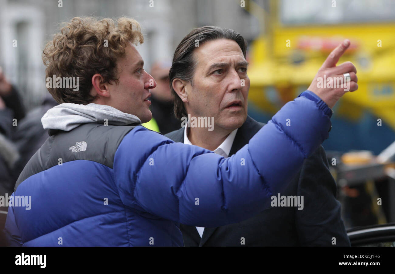 Actor Ciaran Hinds (right) pictured during a break from filming of 'The Sea' starring Ciaran Hinds and Sinead Cusack on Mount street Dublin today. Stock Photo