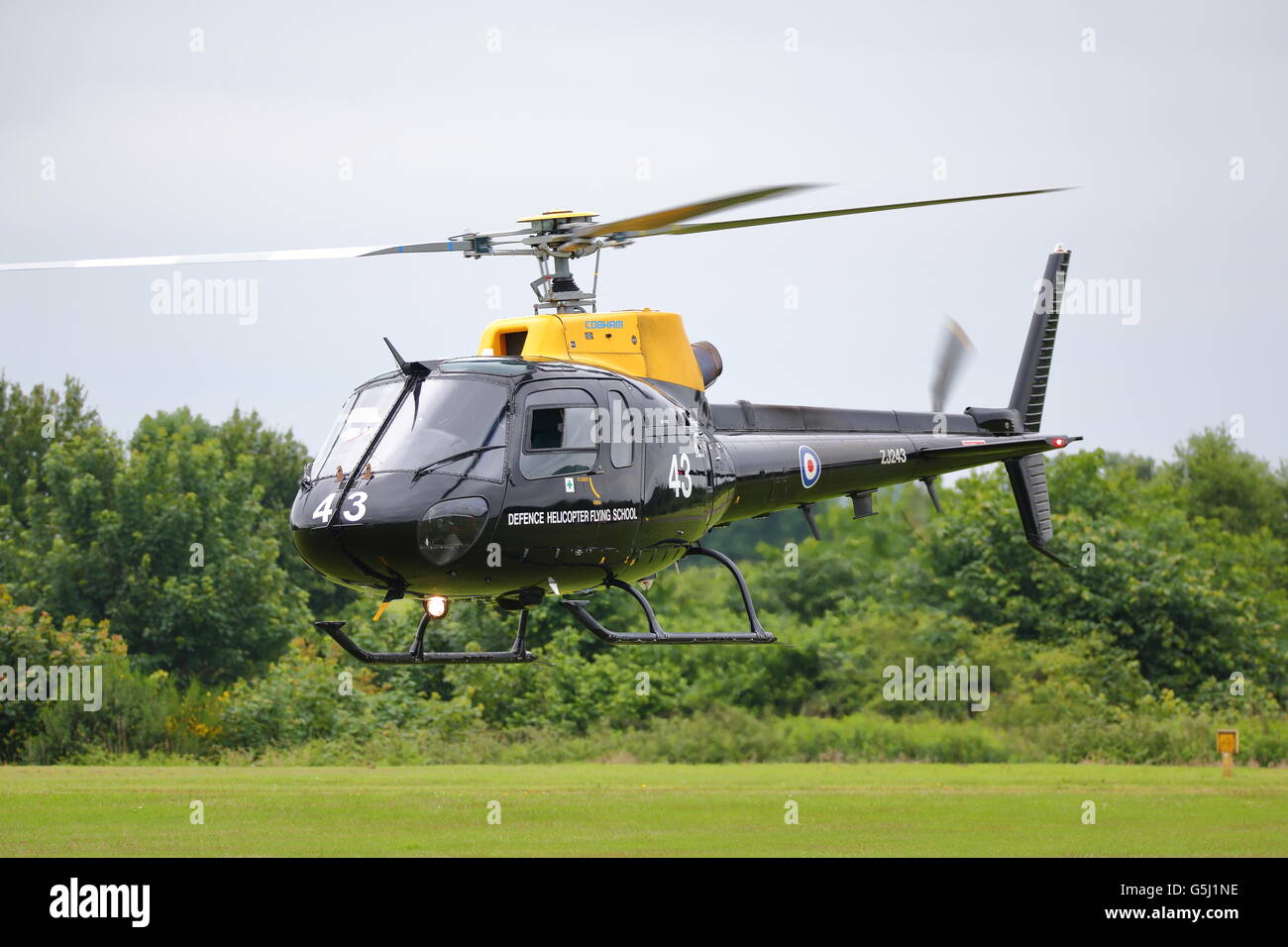 A Eurocopter AS.350BB ZJ243 flying into RAF Cosford during the annual Air Show Stock Photo