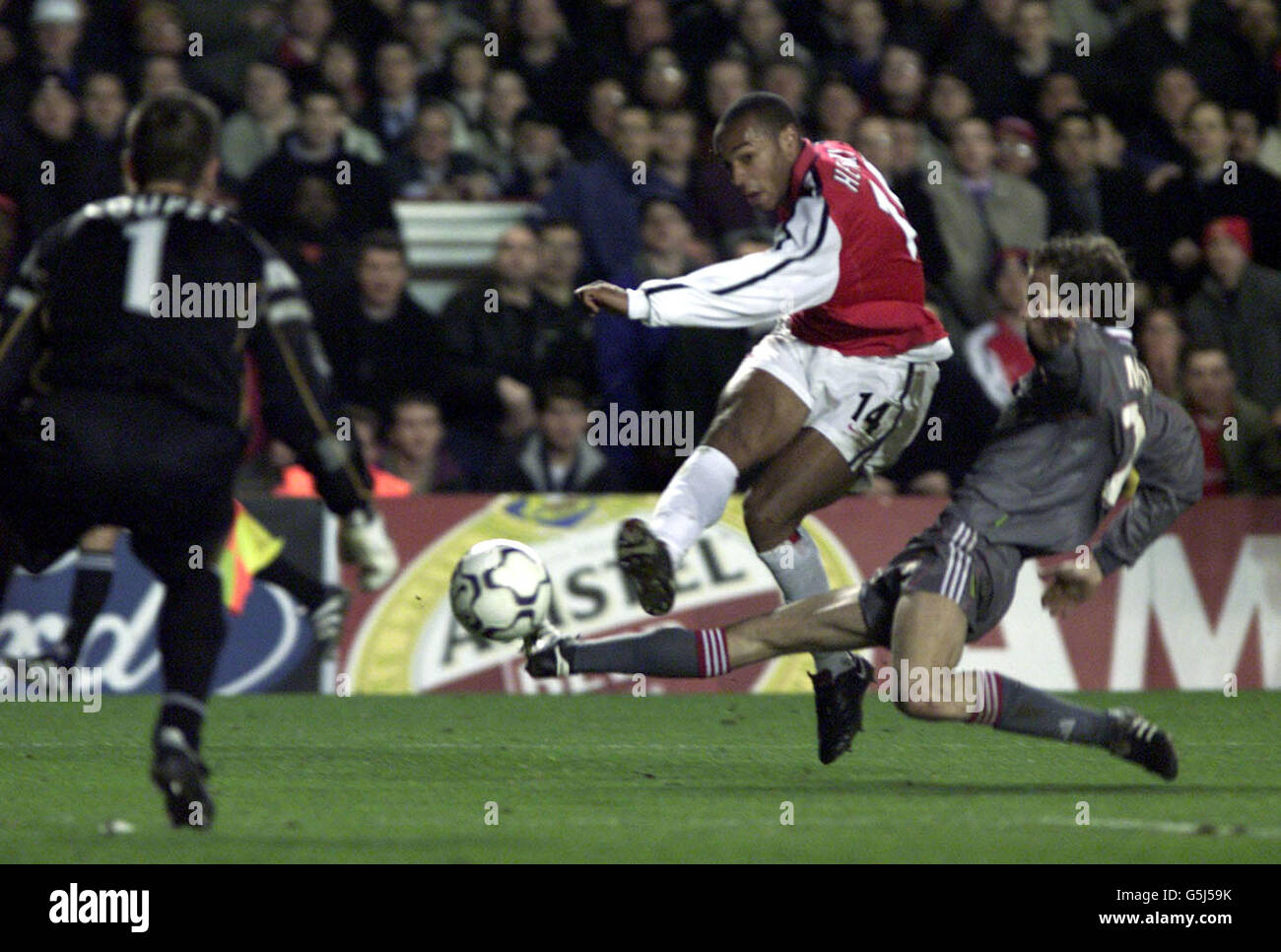 Arsenal's Thierry Henry goes for goal but fails to beats the Lyon 'keeper Gregory Coupet during their Champions League match at Highbury Stadium. Stock Photo