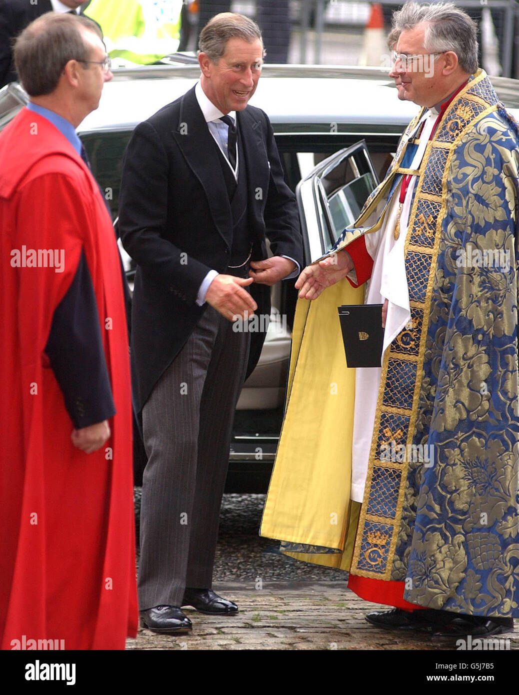The Prince of Wales being greeted by the Dean of Westminster Abbey, Dr Wesley Carr as he arrives at a service of thanksgiving at the Abbey in London celebrating the life of comic Sir Harry Secombe. The Goon Show legend, who died in April 2001 from cancer at the age of 79. * and will be remembered by family and friends at the event. The Prince of Wales was among The Goons' most prominent fans and led the tributes following his death. Sir Harry was also known for his fine tenor singing voice which he used to great effect on the religious TV programmes he presented, such as Highway and Songs Of Stock Photo