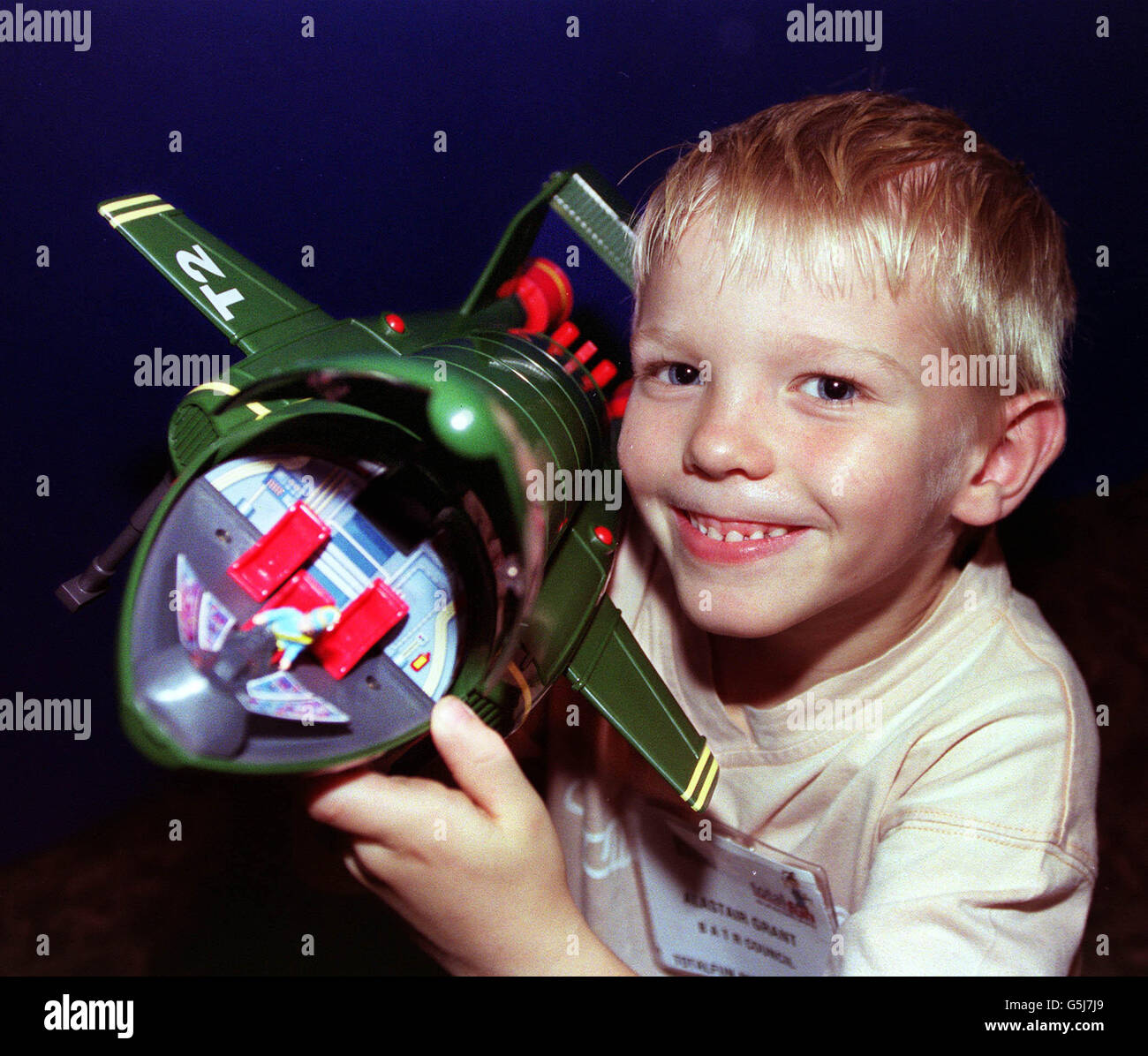 Six year-old Alastair Grant from Chorley Wood, Herts, plays with a Thunderbirds Electronic Playset - one of the top ten toys according to the British Association of Toy Retailers, at the launch of the British Toy and Hobby Association's Totalfun fair at Olympia, London. Stock Photo