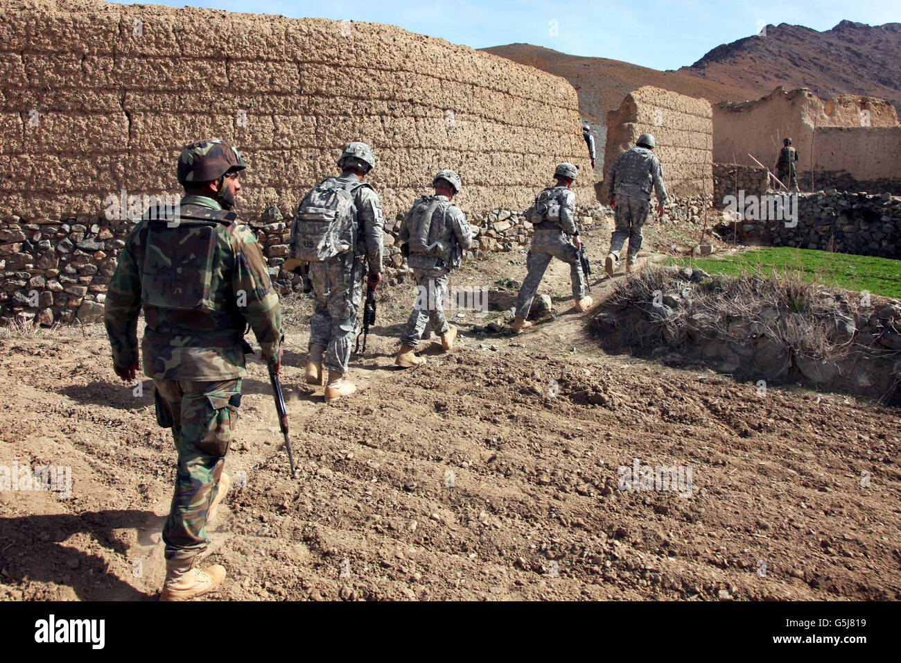 Afghan National Army and U.S. Soldiers in the village of Akbar Kheyl ...