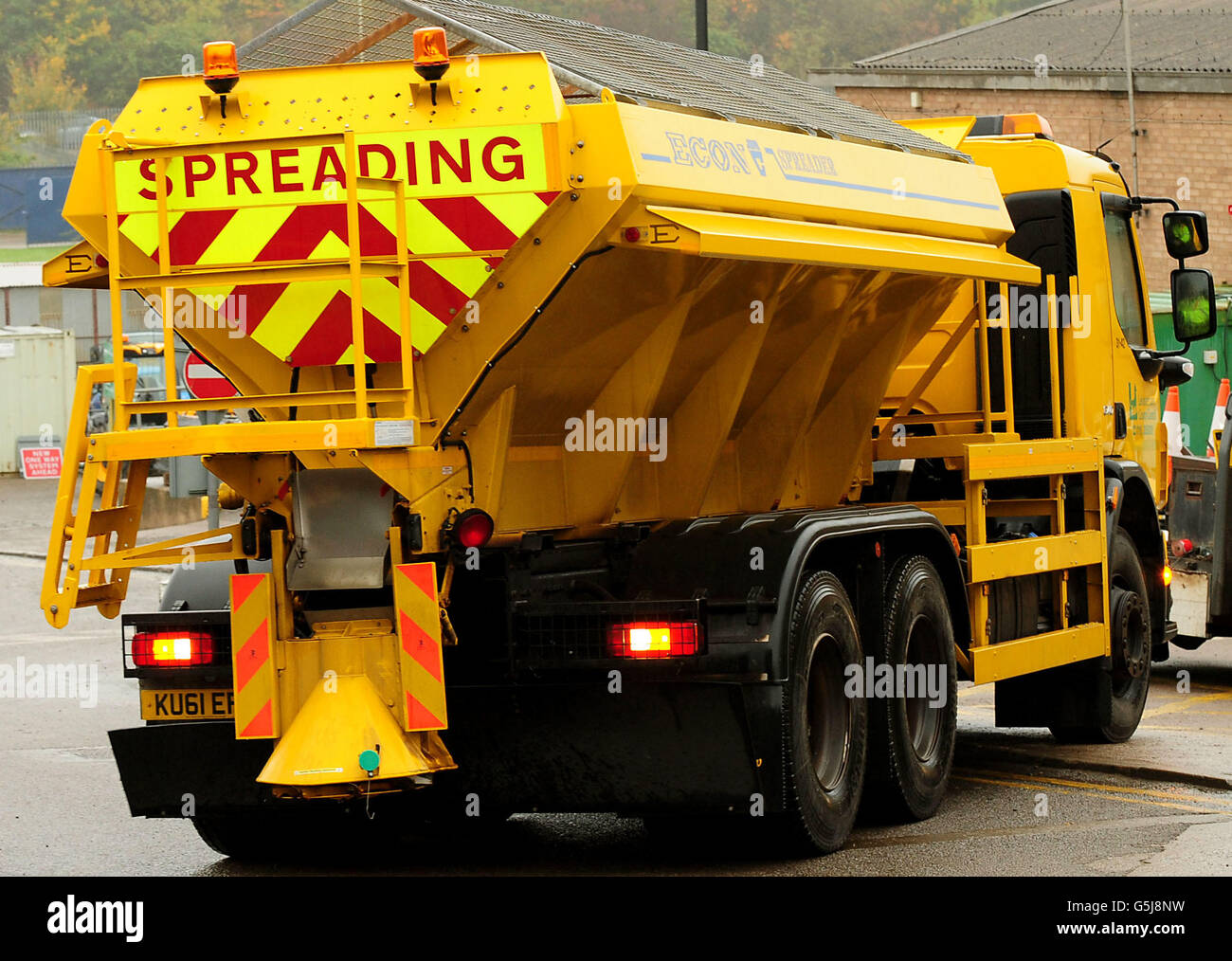 A gritting truck is loaded with a stockpile of salt and molasses mixture used for road gritting, in preparation for the winter season at the Northern Highway Depot, Mountsorrel, Leicestershire. Stock Photo
