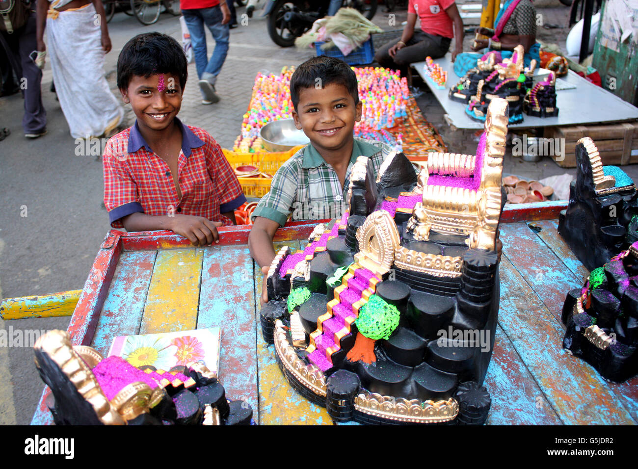 Little kids from India enthusiastic to buy traditional clay toys for Diwali festival. Stock Photo