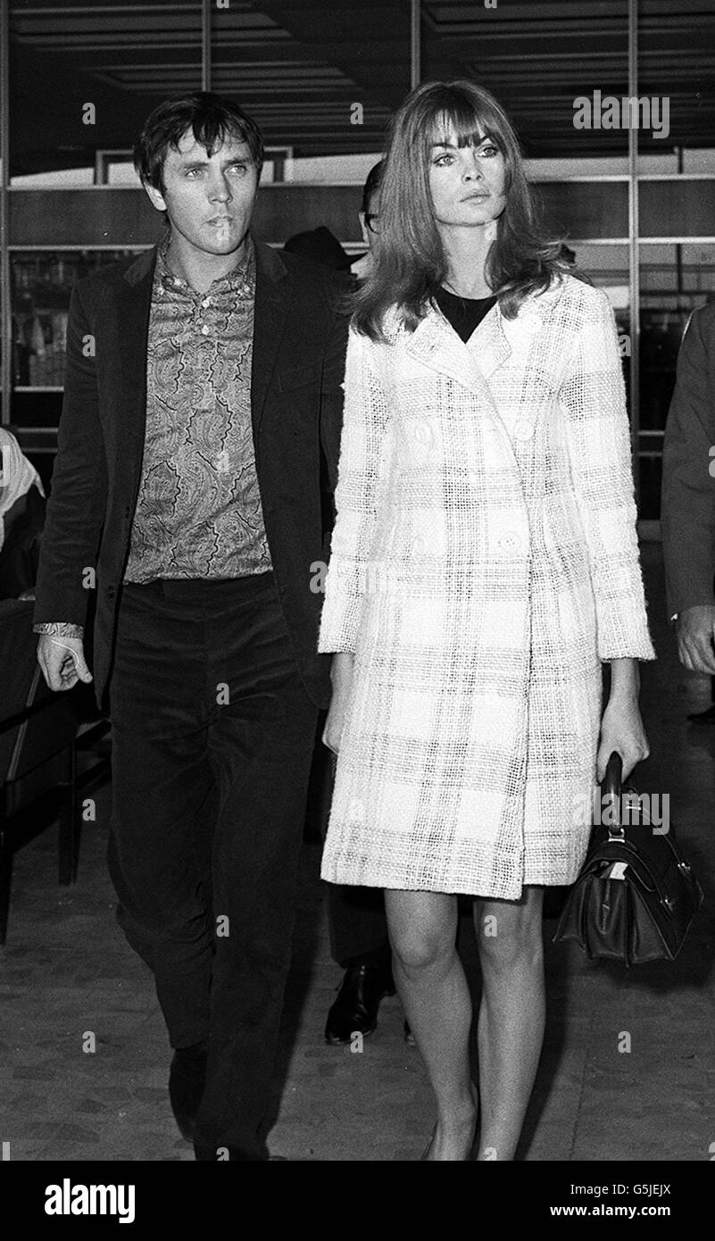 Model Jean Shrimpton and friend actor Terence Stamp at London Airport where they were leaving for San Francisco on the first stage of their holiday to Australia. Stock Photo