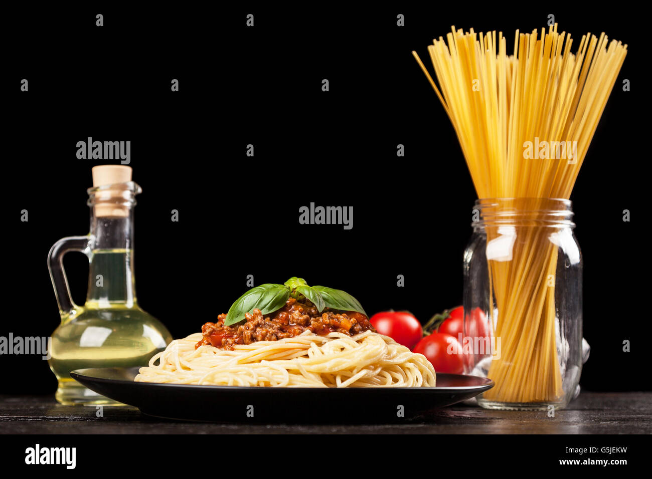 Spaghetti bolognese on dark background Stock Photo - Alamy