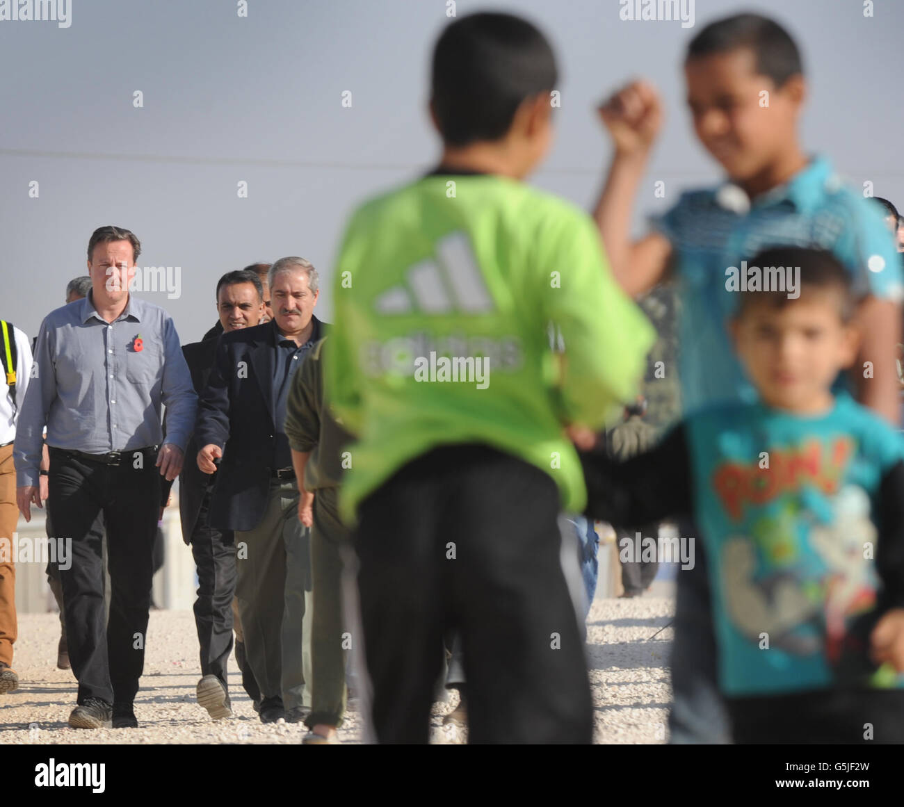 Prime Minister David Cameron tours the Za'atri refugee camp near the Syrian - Jordanian border where he met Syrian families who have escaped across the border into Jordan from the Assad regime. Stock Photo
