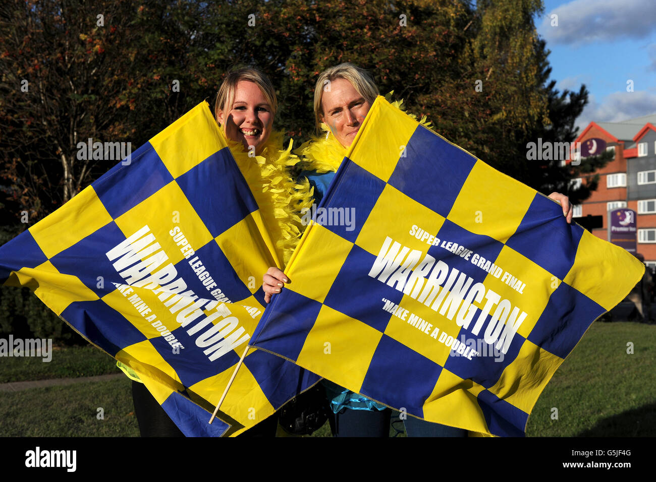 Warrington wolves fans wave flags before match hires stock photography