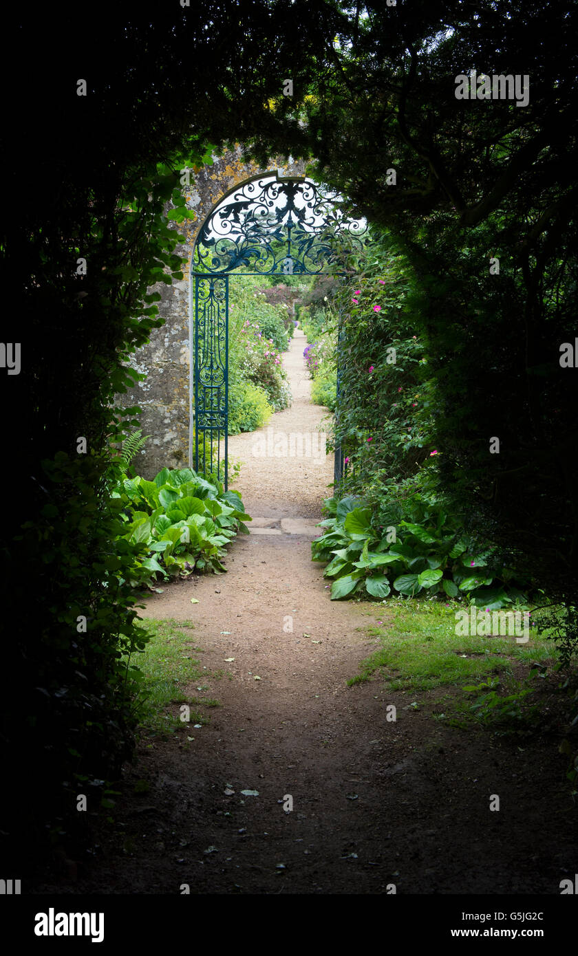 Walled garden blue wrought iron gate at Rousham House and Garden. Oxfordshire, England Stock Photo