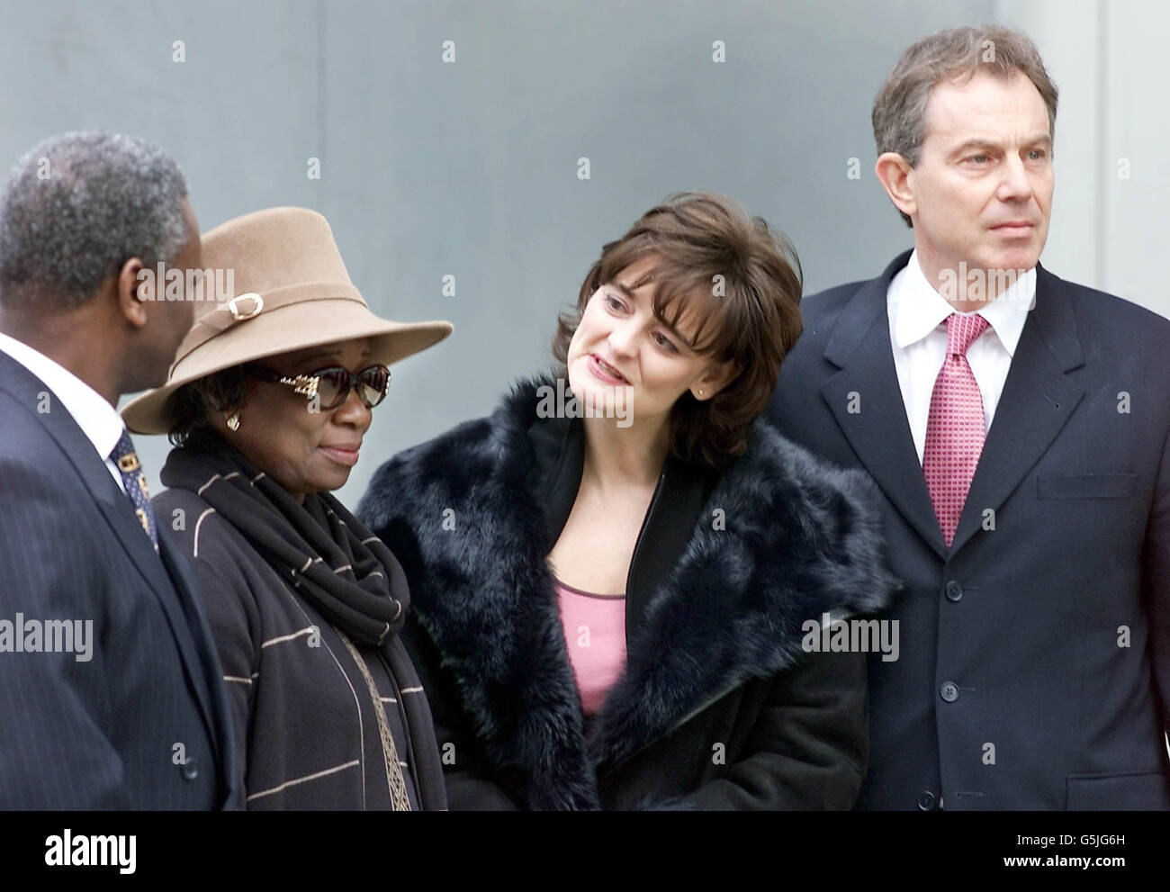 Cherie Blair, wife of British Prime Minister Tony Blair, comforts
