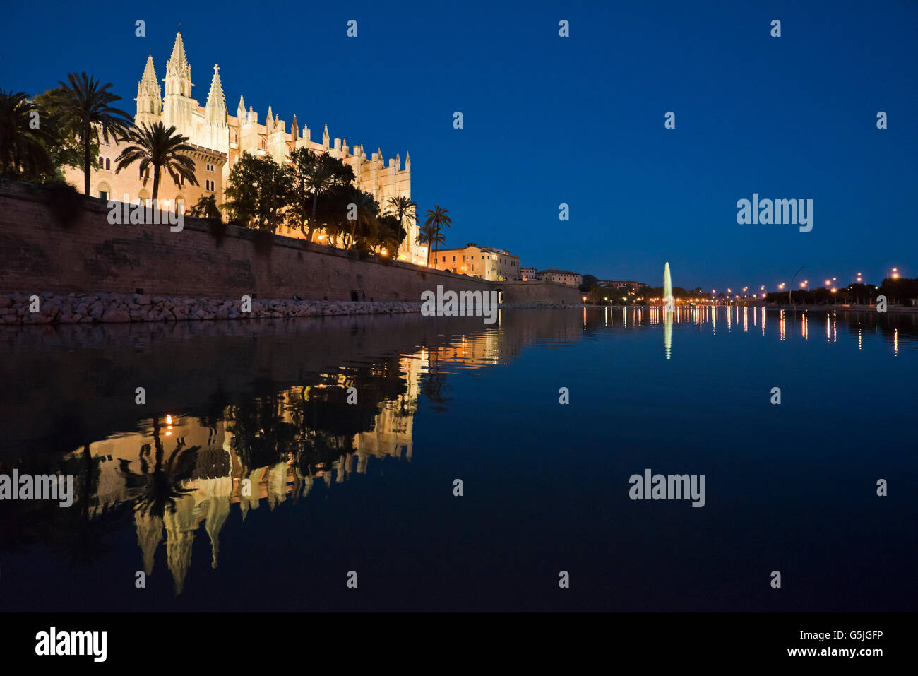 Horizontal panoramic (2 picture stitch) night time view of the Cathedral of Santa Maria of Palma, aka La Seu, in Majorca. Stock Photo