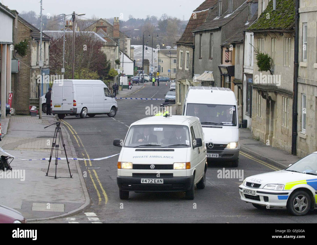 A body is driven away in an ambulance after being taken from the scene