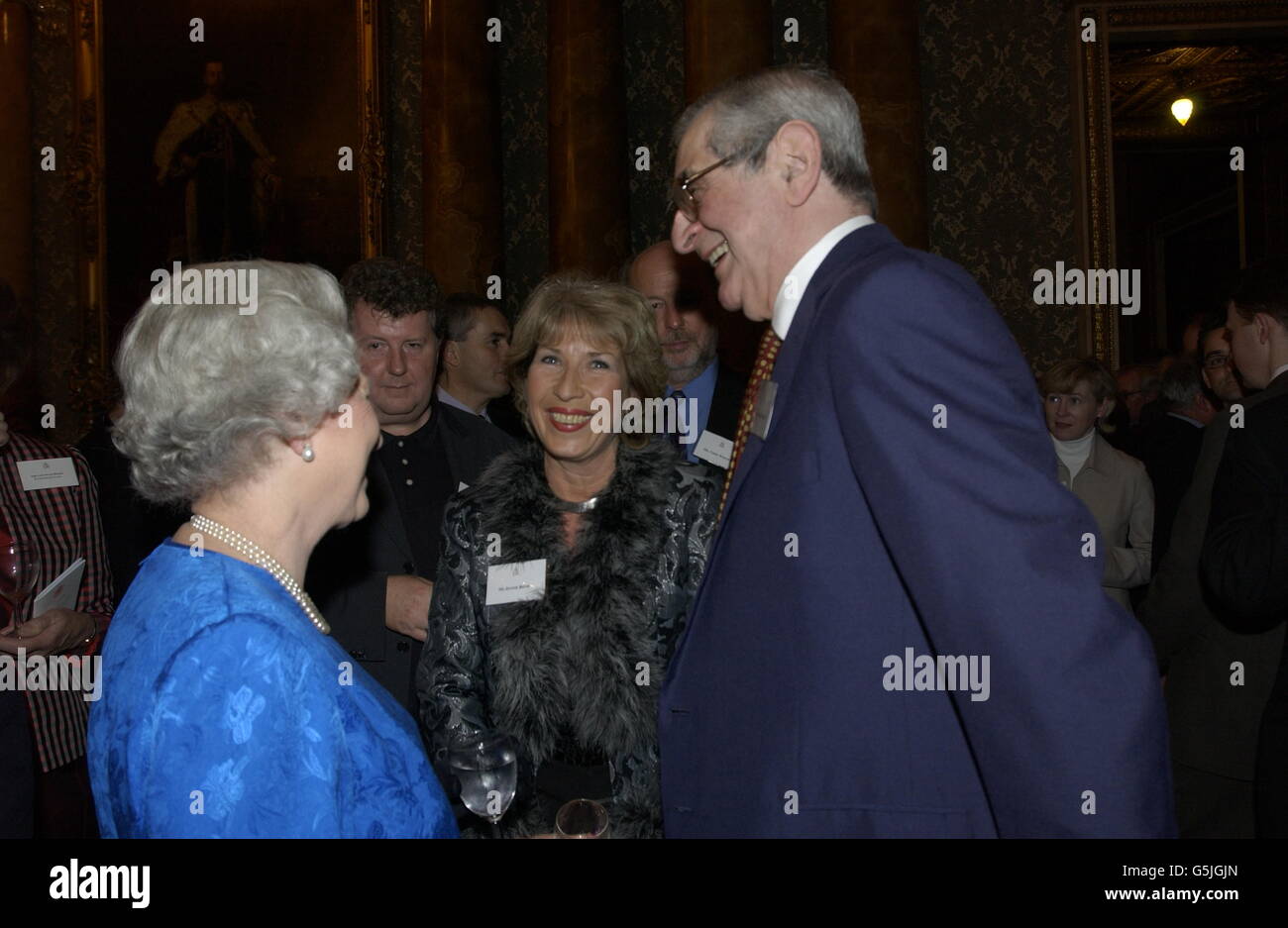 The Queen with Royal correspondent Jennie Bond and Dennis Norden at a reception for the British broadcasting industry in Buckingham Palace. Stock Photo