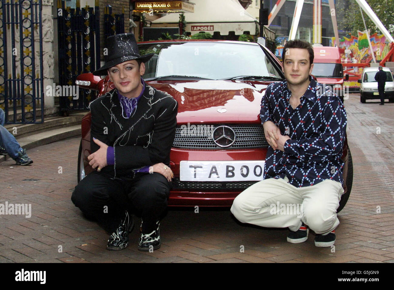 Culture Club's Boy George (R) poses with Euan Morton during a photocall in London,where it was announced that Morton will make his West End debut, when he plays singer/DJ in Taboo, a musical with music and lyrics by George based on the 80's pop era. Stock Photo