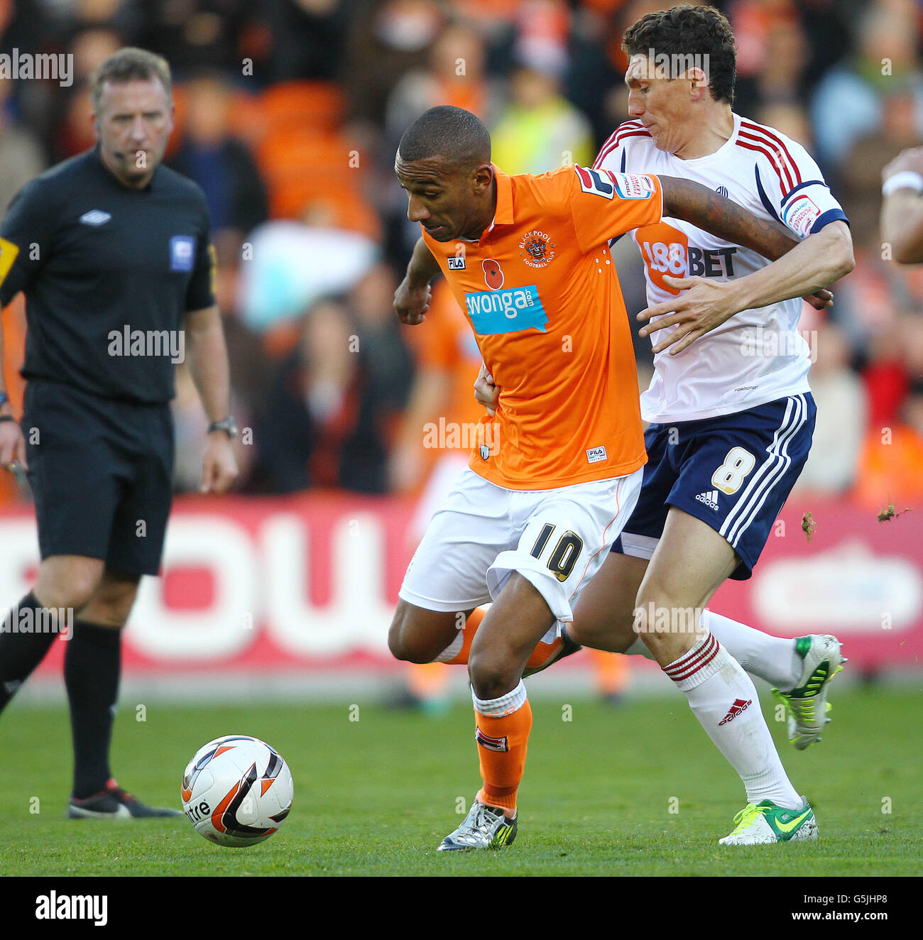 Blackpool's Elliott Grandin and Bolton's Keith Andrews during the npower Football League Championship match at Bloomfield Road, Blackpool. Stock Photo