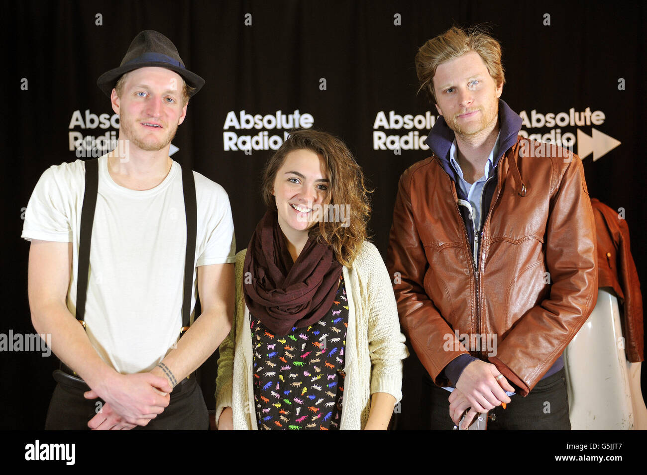American rock-folk band the Lumineers (left to right) Jeremiah Fraites,Neyla Pekarek and Wesley Schultz, during a short musical session for Absolute Radio live, at their studios in central London. Stock Photo