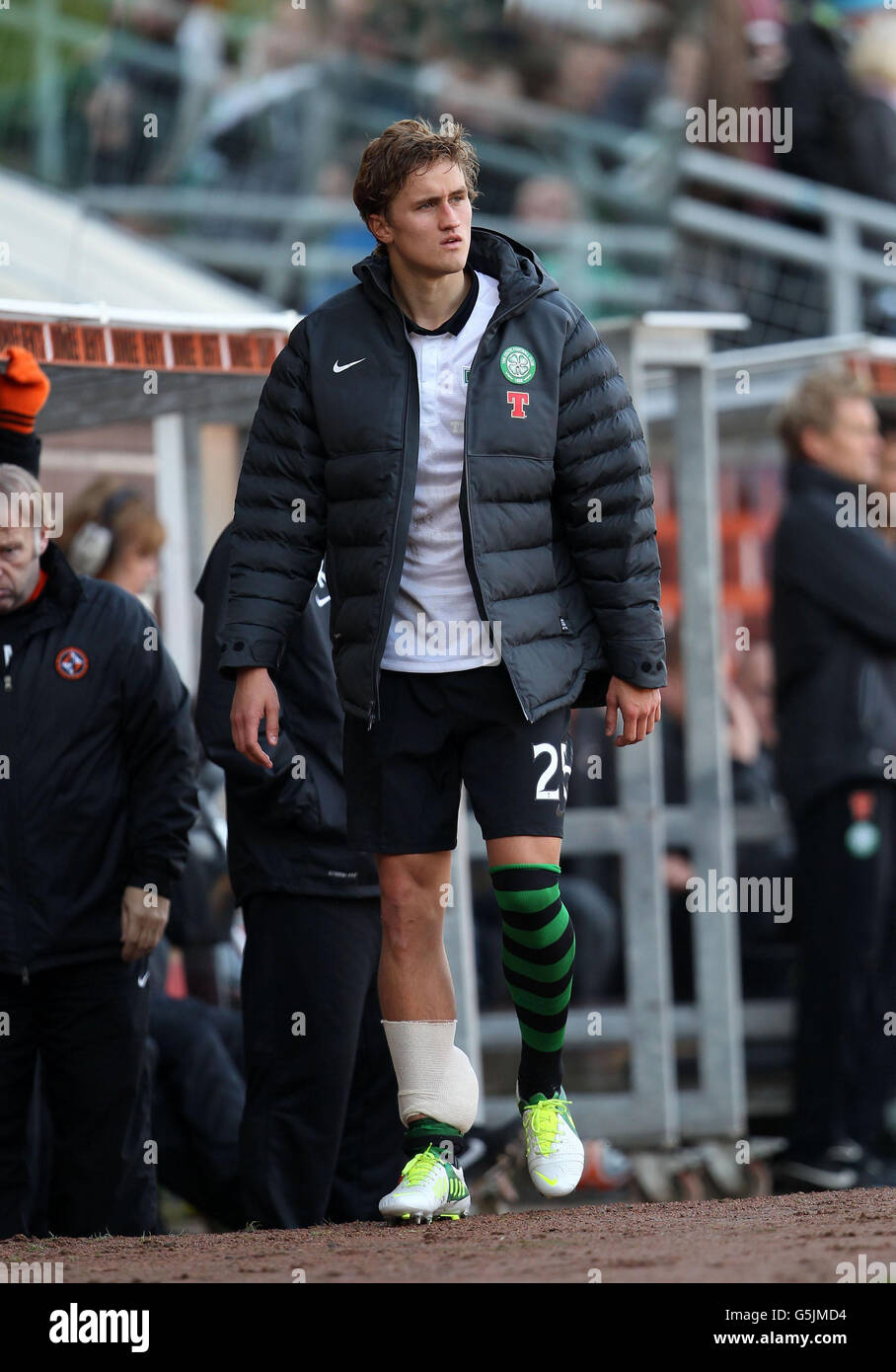 Celtic's Thomas Rogne limps off injured during the Clydesdale Bank Scottish  Premier League match at Tannadice Park, Dundee Stock Photo - Alamy