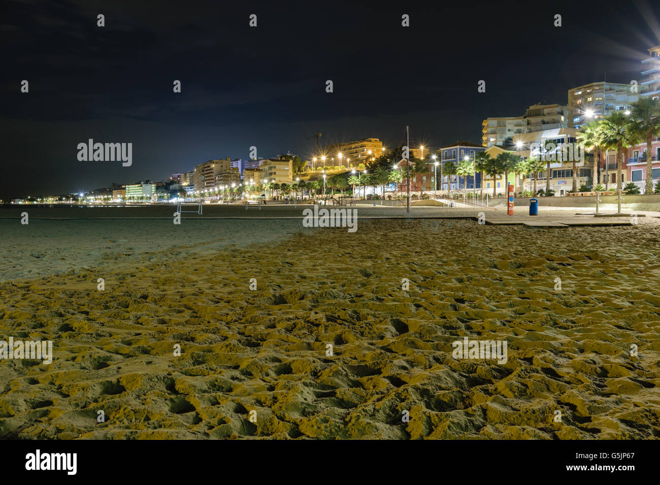 Beach and cityscape of Villajoyosa at night, Spain Stock Photo
