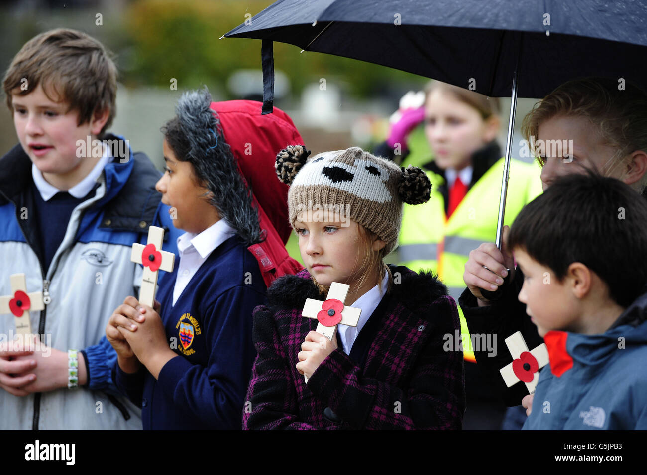 Primary school pupils from York wait to place Remembrance poppy crosses