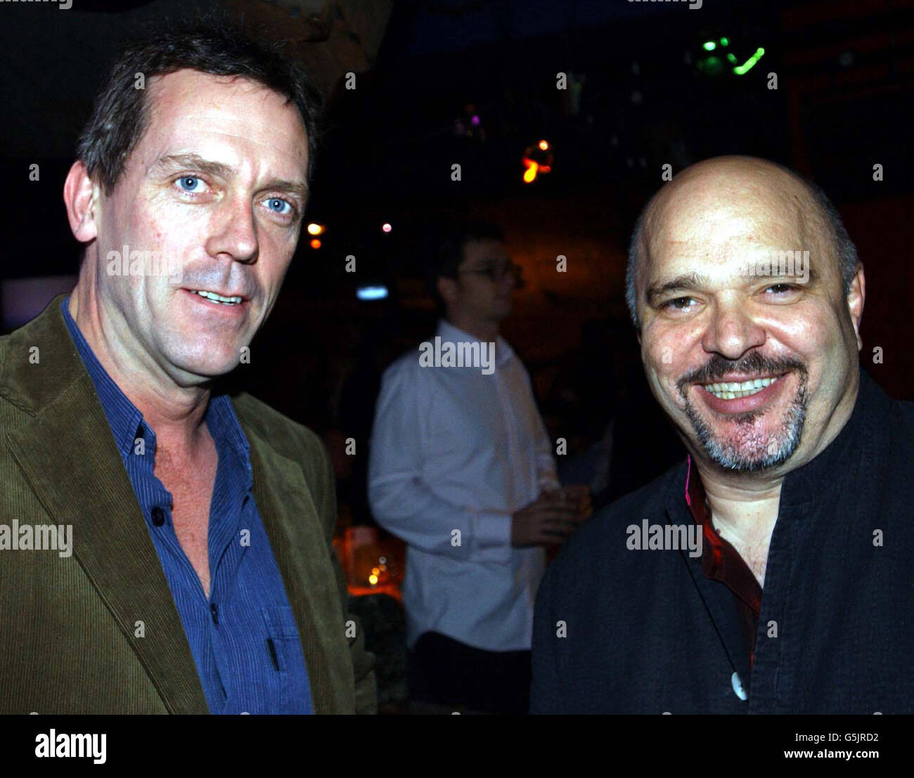 Actor Hugh Laurie (L) and director Anthony Minghella at the Oscar Moore Foundation Annual Film Quiz, at Sound in London, where the Oscar Moore Screenwriting Prize will be presented, this year's genre is Thriller. omsa Stock Photo