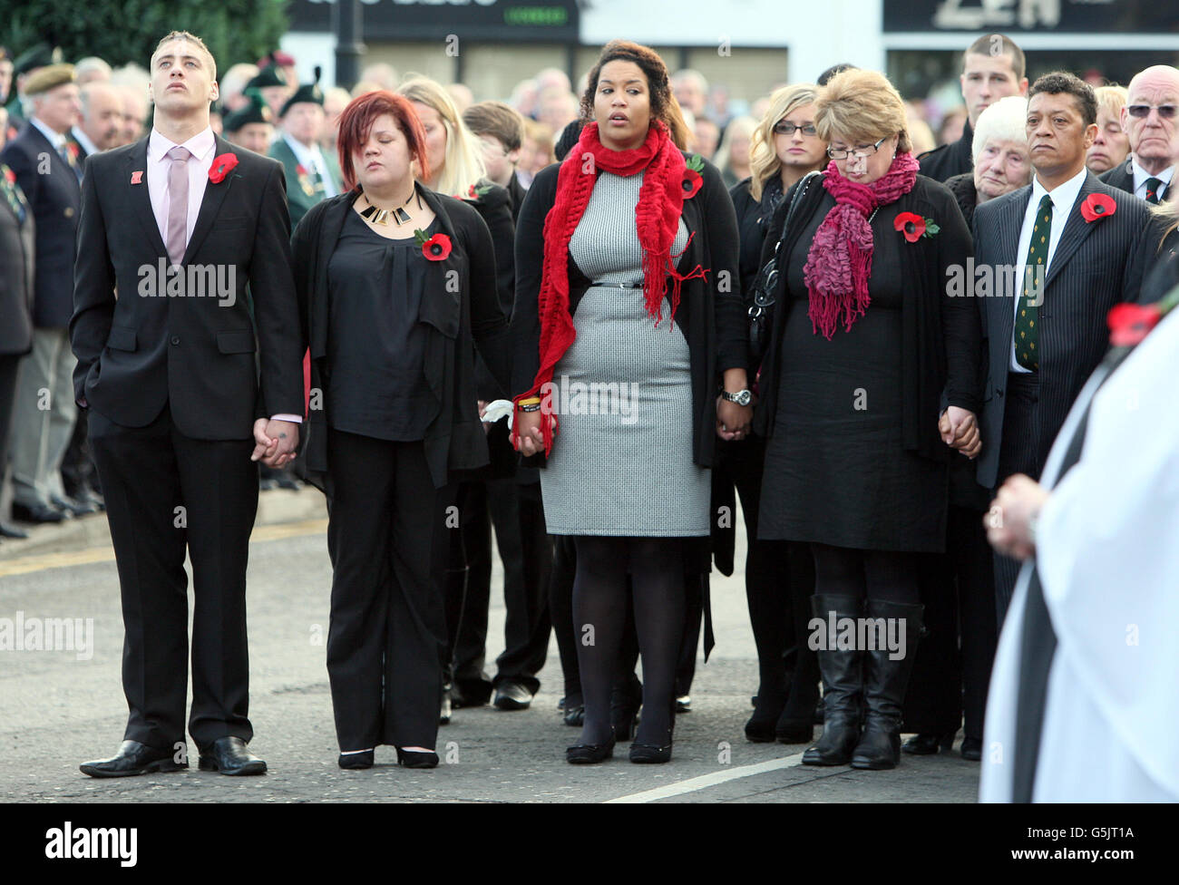 Leslie (right) and Rosemary (second right), parents of Corporal Channing  Day, who was killed in Afghanistan, walk behind her coffin with her brother  Aaron and sisters Lauren and Lakan, as it is