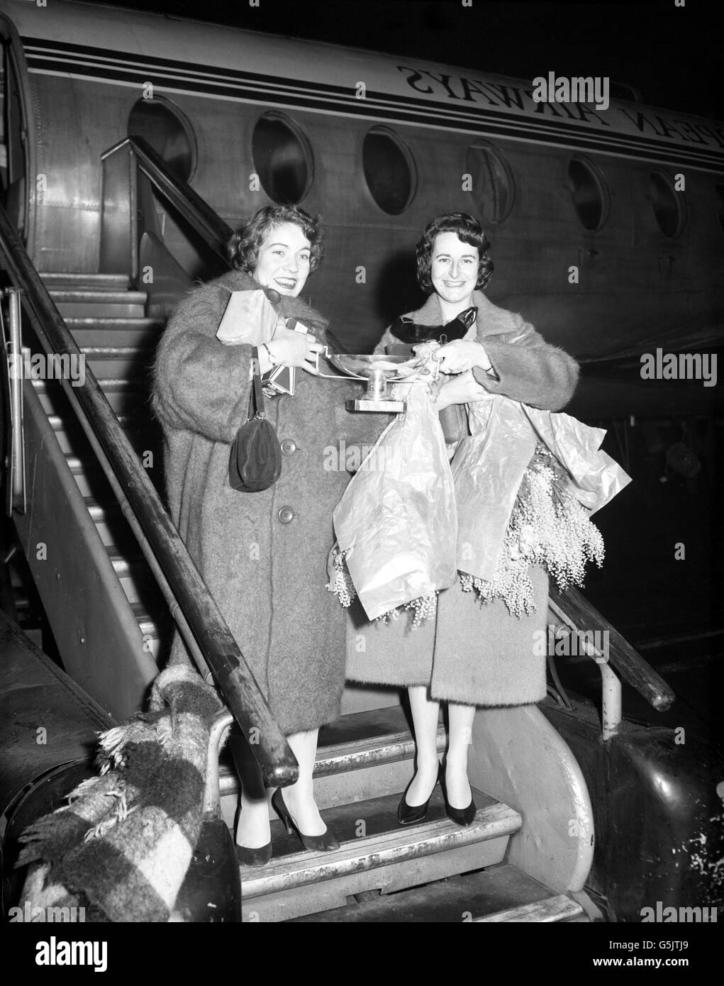 British drivers Ann Wisdom (left) and Pat Moss arrive back in London ...