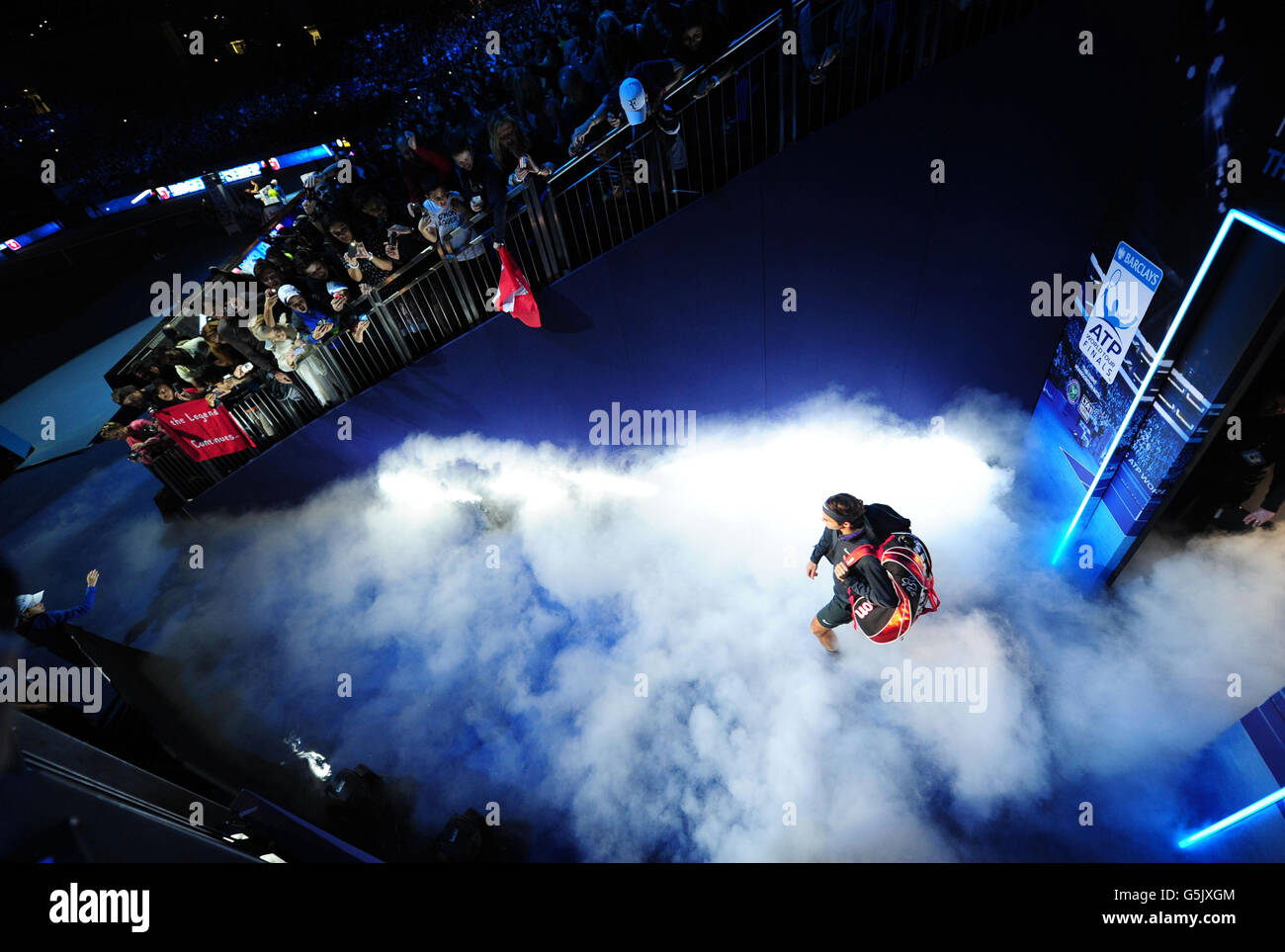 Switzerland's Roger Federer walks out onto court to face Great Britain's Andy Murray during the Barclays ATP World Tour Finals at the O2 Arena, London. Stock Photo