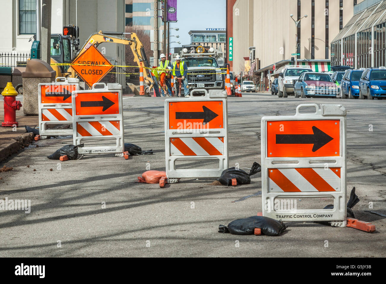 Barricades direct traffic around road construction site in downtown St. Louis, Missouri Stock Photo