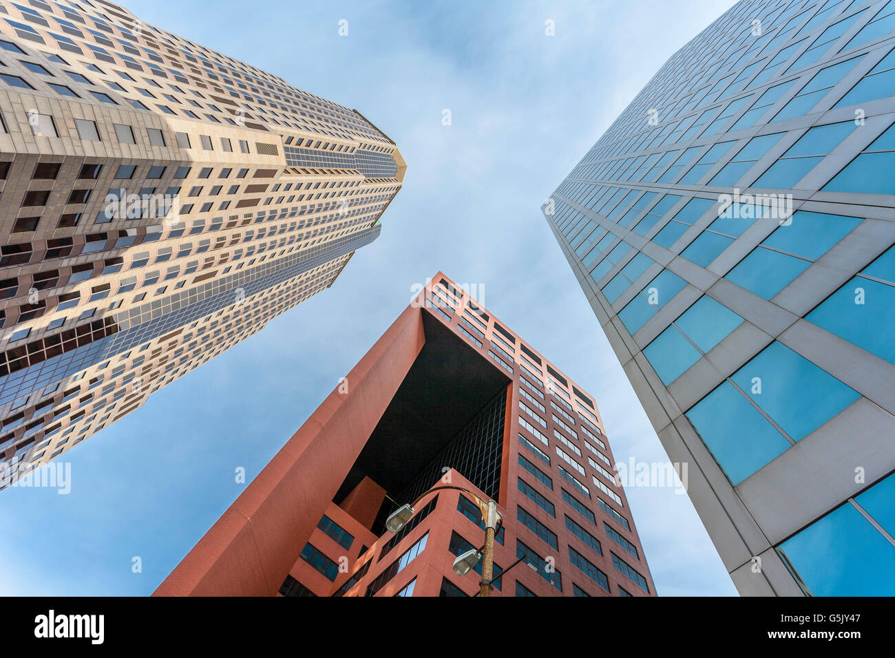 Looking up at the sky between high rise buildings at Broadway and Pine in downtown St. Louis, Missouri Stock Photo