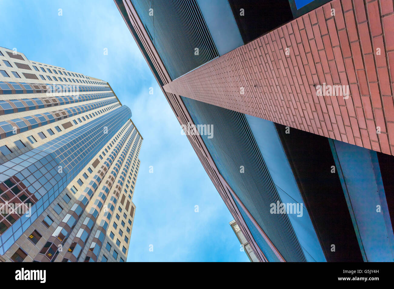 Looking up at the sky between high rise buildings near Broadway and Pine in downtown St. Louis, Missouri Stock Photo