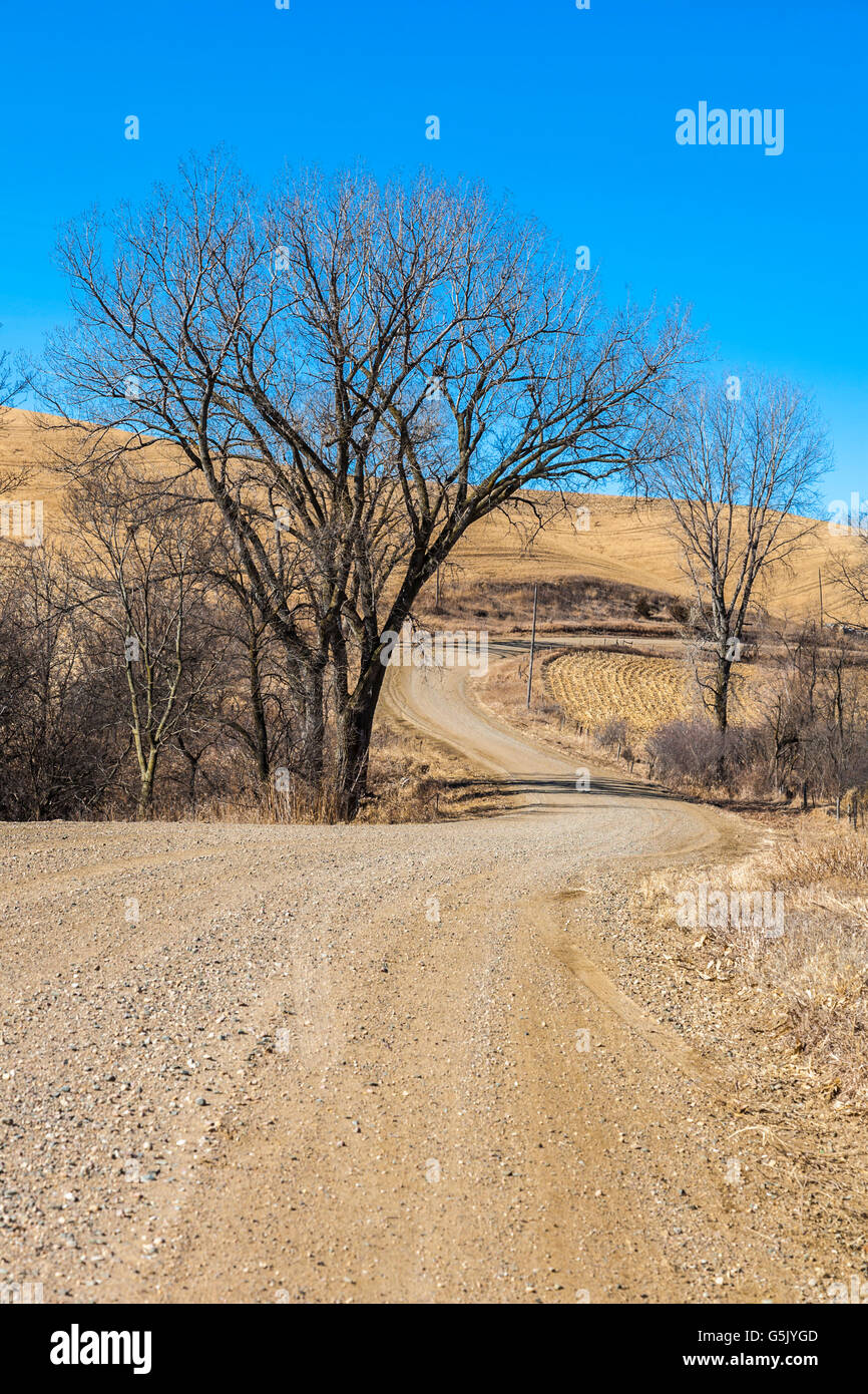 Winding gravel road through the rolling hills of western Iowa is part of the Loess Hills National Scenic Byway Stock Photo