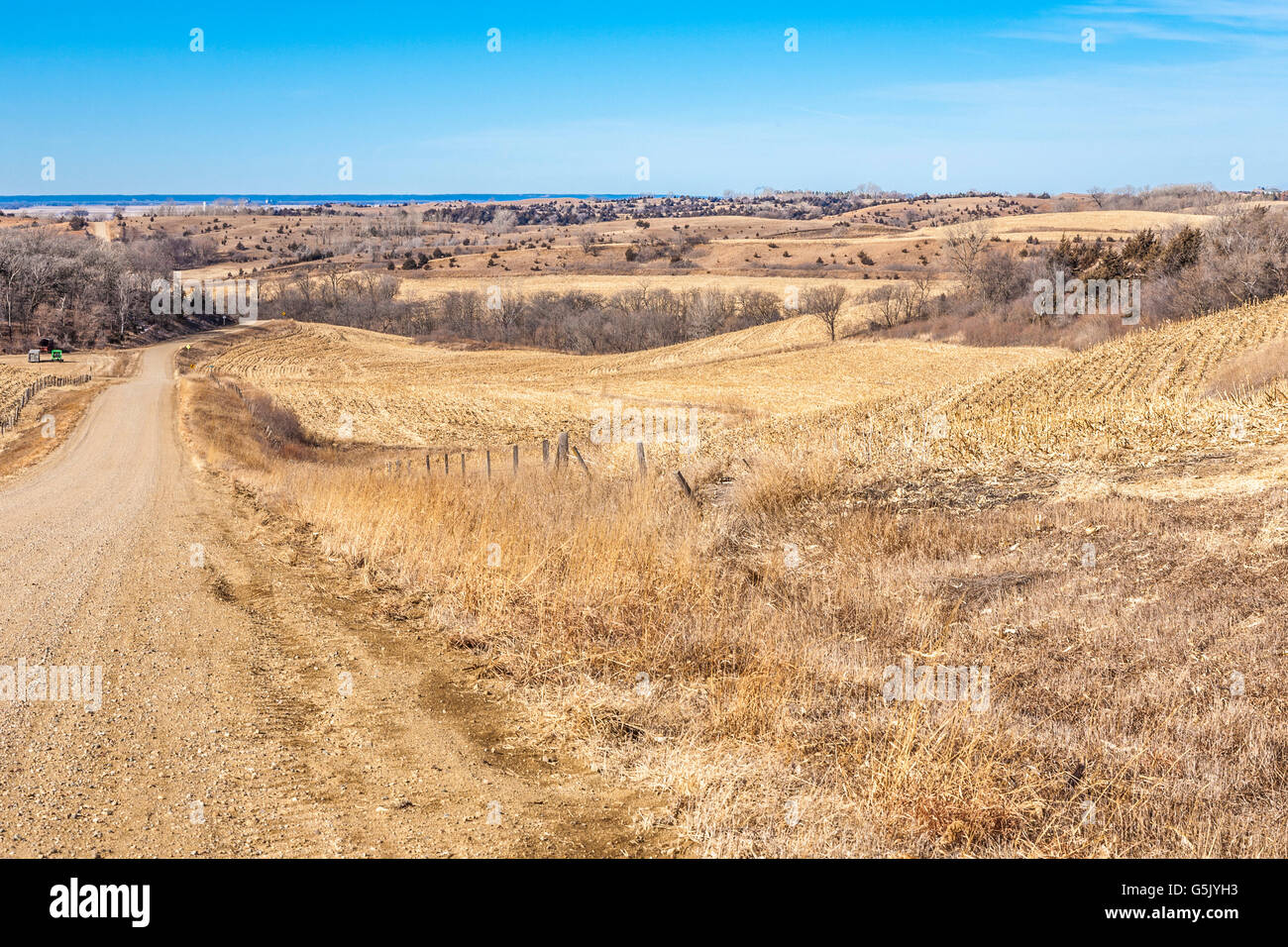 Winding gravel road through the rolling hills of western Iowa on the 