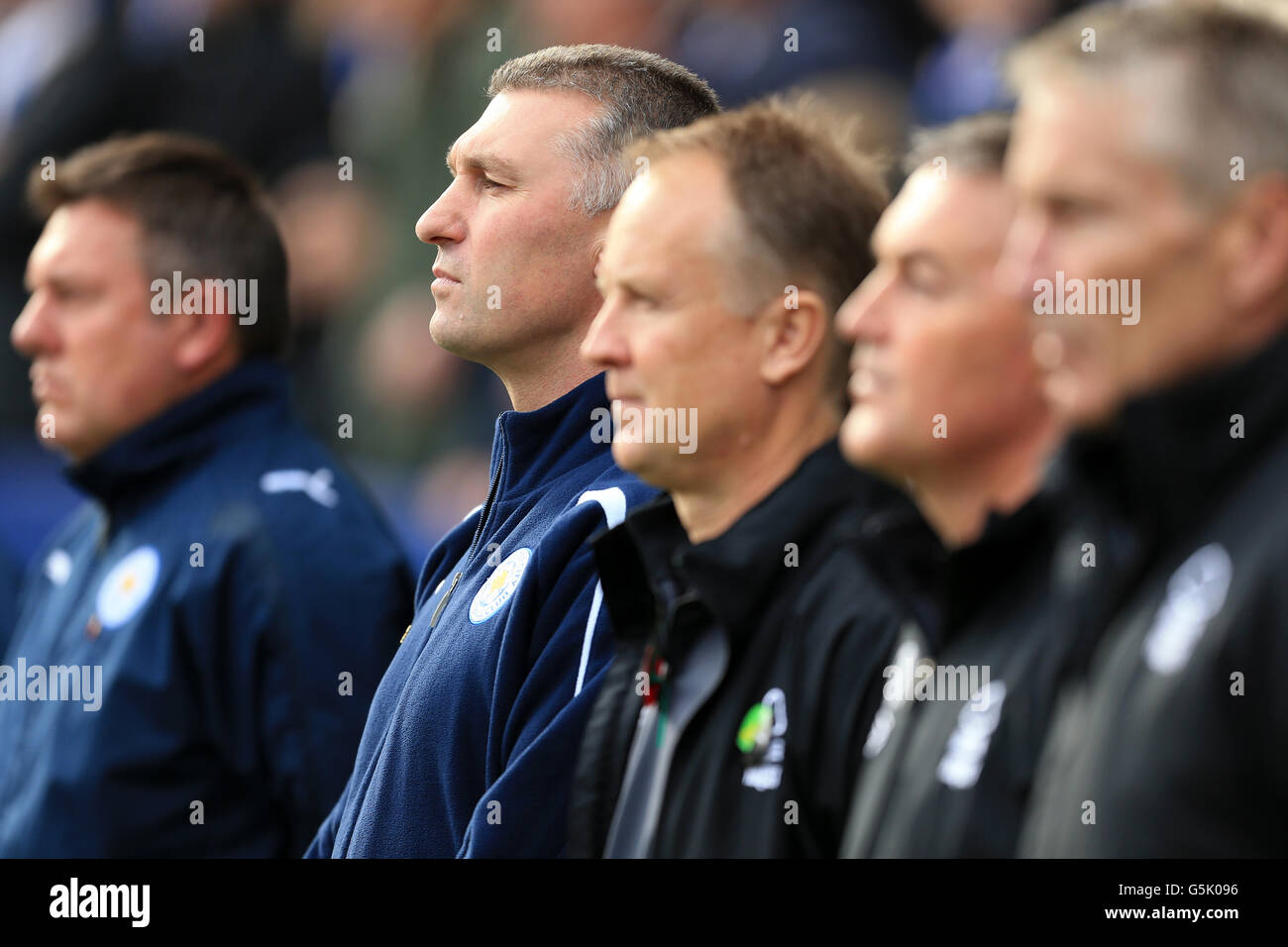 Leicester City manager Nigel Pearson (second left) stands beside ...